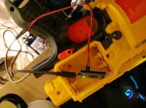 Arduino mounted to the side of the Nerf gun, reading the trigger and reporting button state to the PC