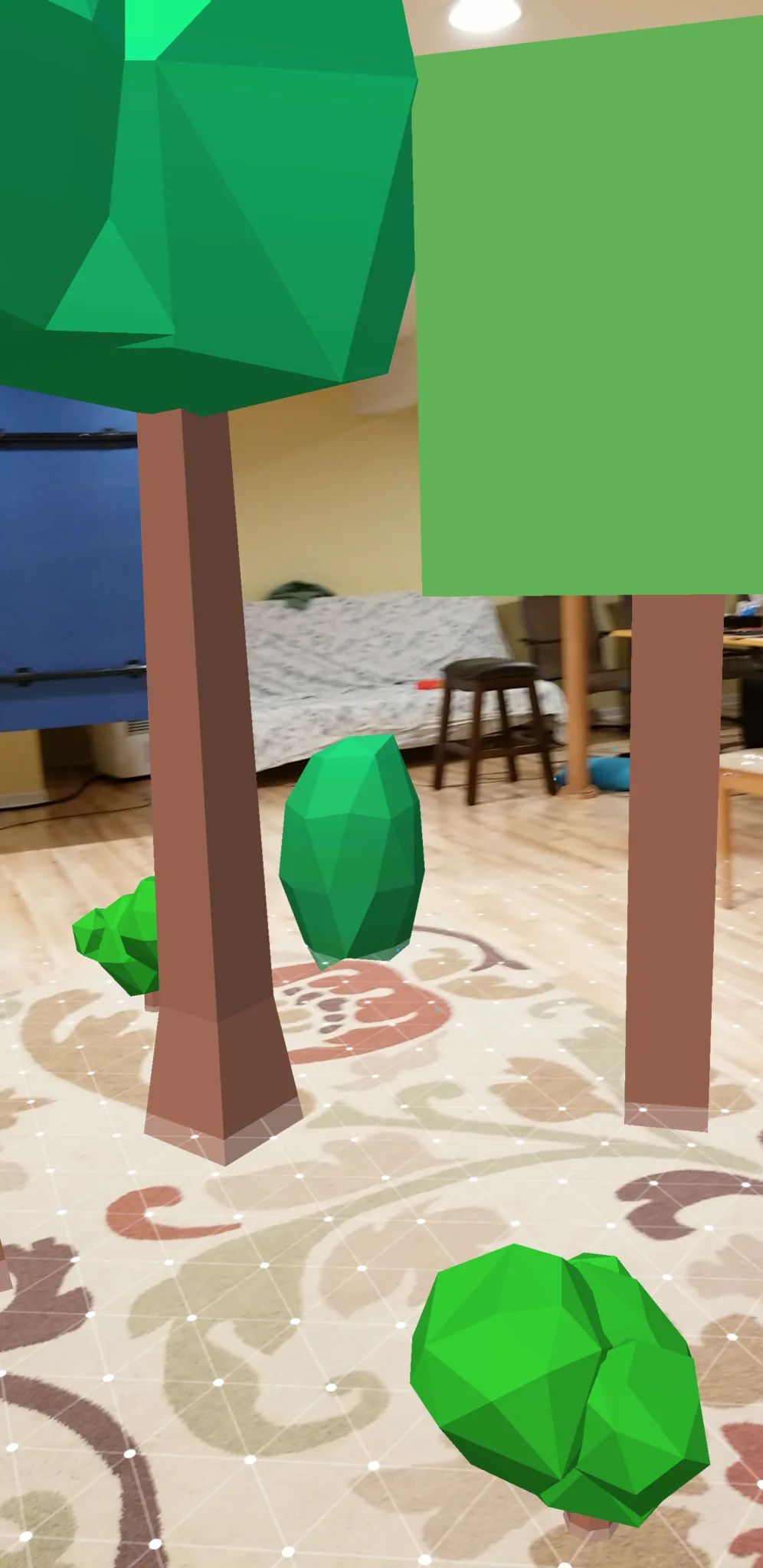 Bushy round-topped and pine trees placed in the ARCore virtual forest with matching room lighting